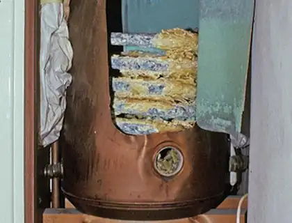 Hot water cylinder with internal limescale deposits