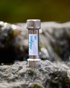 Halcyan water conditioner showcased on some rocks